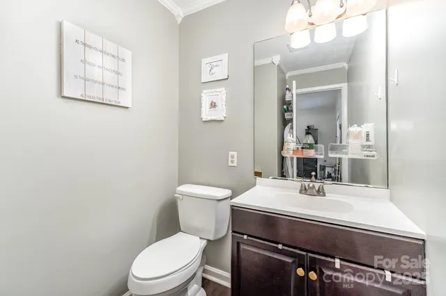 a view of a livingroom with workspace and a window