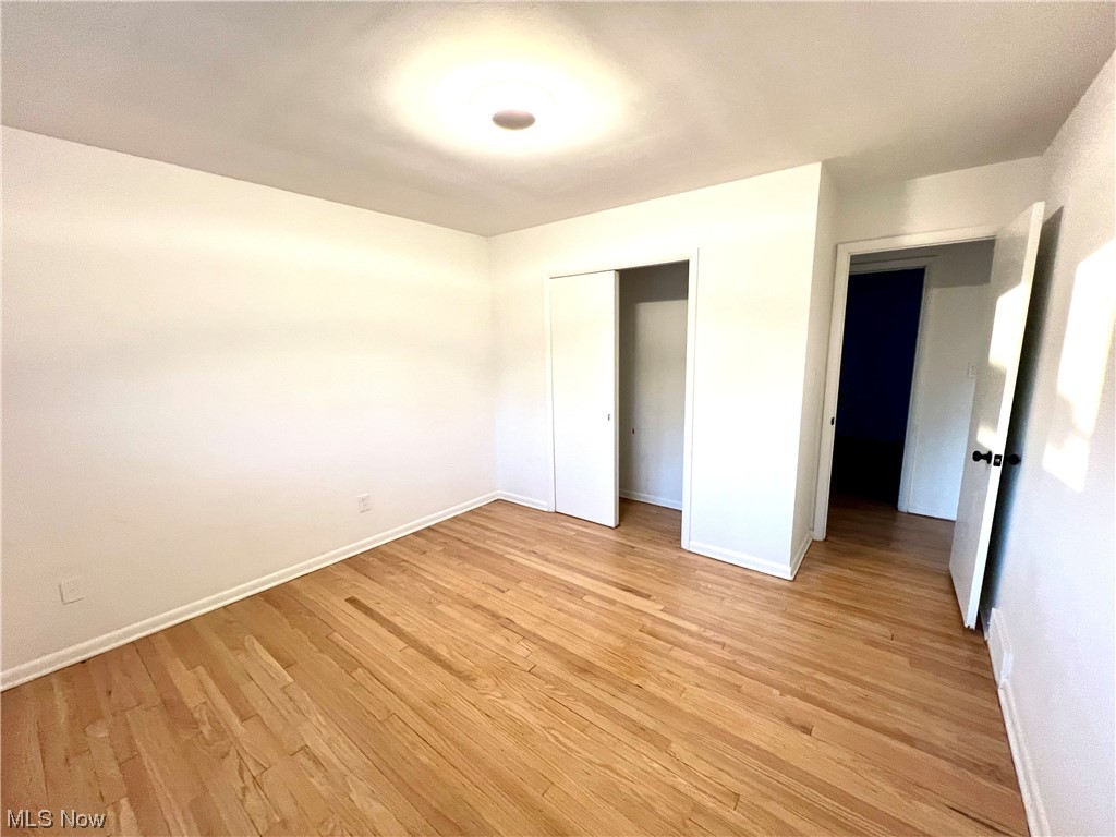7687 Ragall Parkway Cleveland, OH 44130 - Photo 29 of 37 Unfurnished bedroom with light wood-type flooring and a closet