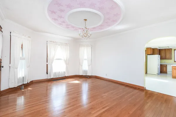 a aerial view of a house a yard basket ball court and outdoor seating