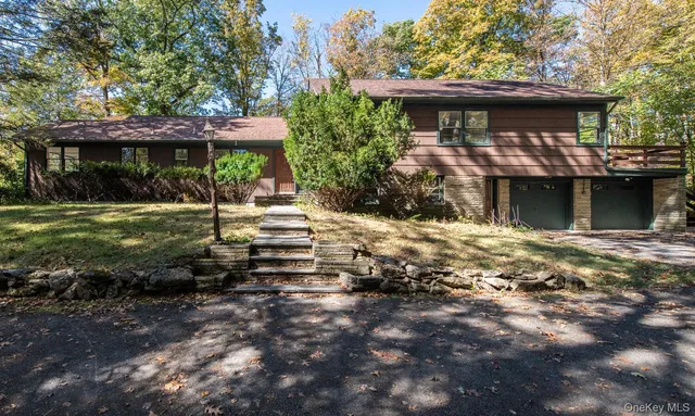 a living room with fireplace furniture and a flat screen tv