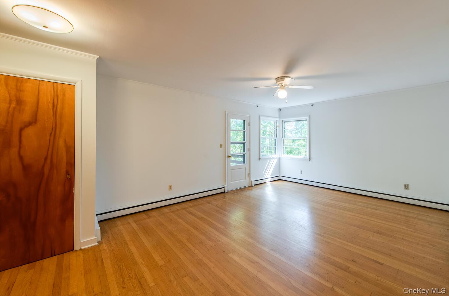 19 Ridgeview Road Poughkeepsie, NY 12603 - Photo 25 of 50 an empty room with wooden floor and windows