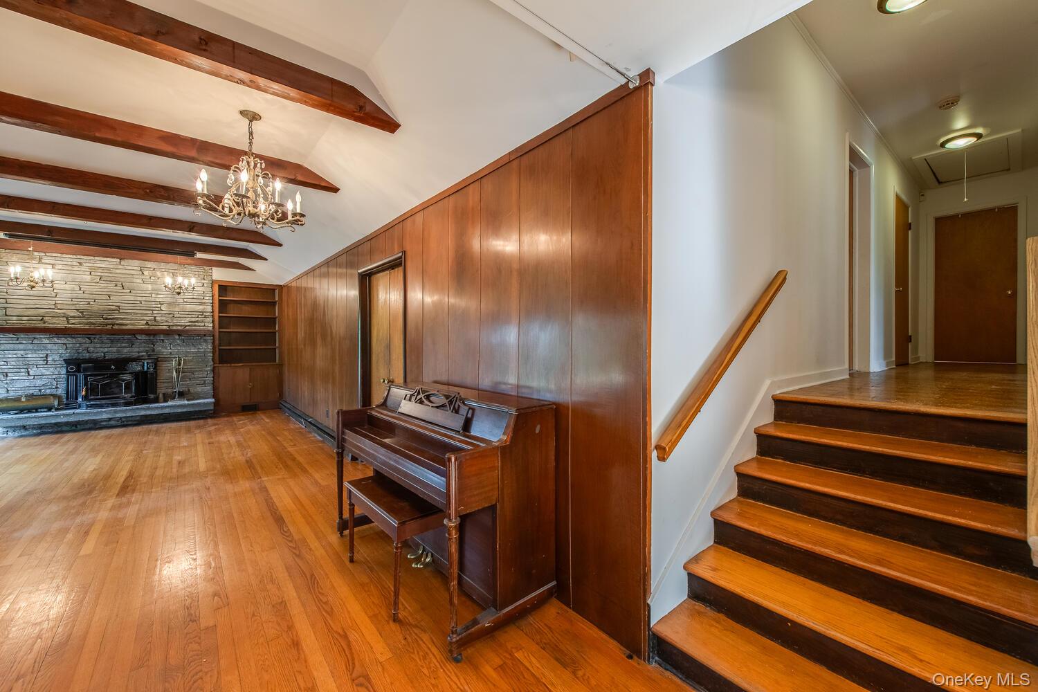 19 Ridgeview Road Poughkeepsie, NY 12603 - Photo 6 of 50 a view of an empty room with wooden floor and stairs