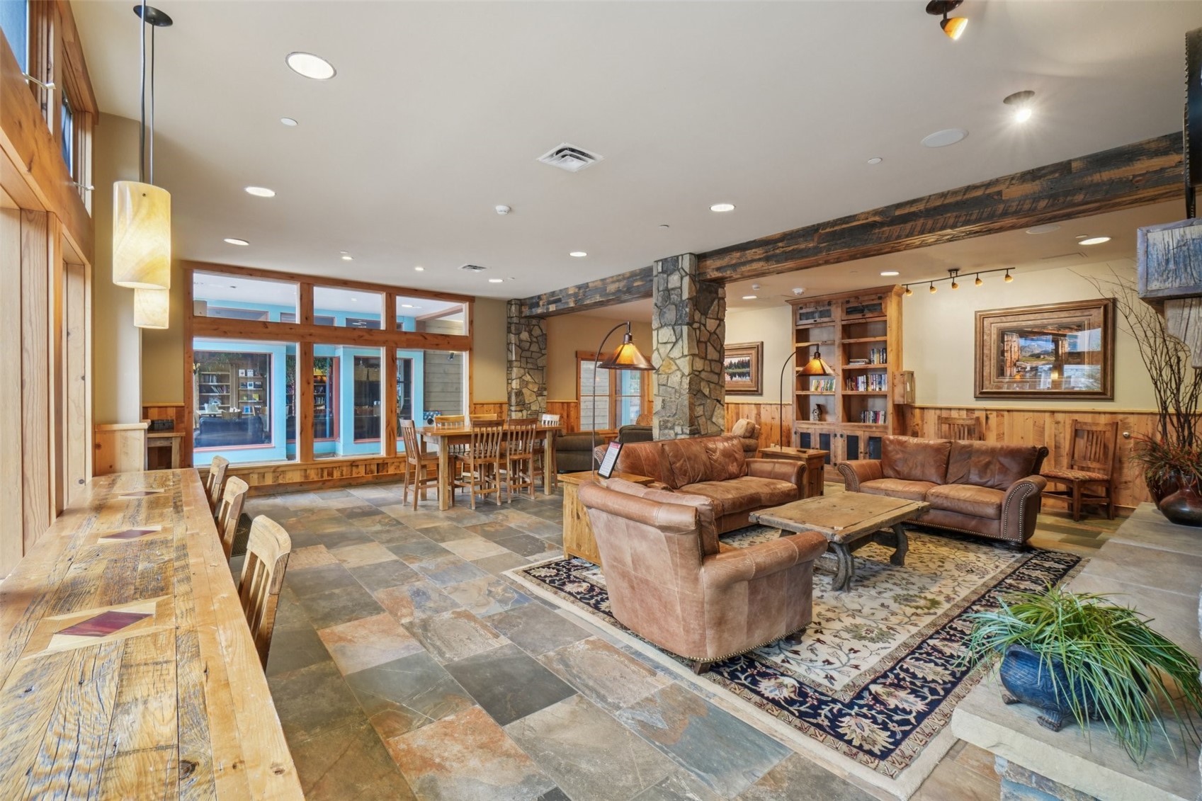 129 River Run Road, Unit 8055 Keystone, CO 80435 - Photo 32 of 50 Living area featuring decorative columns, recessed lighting, and stone finish floors