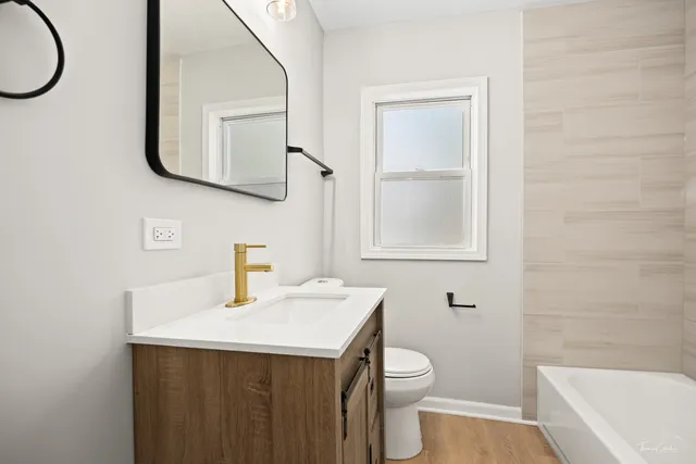 a view of a livingroom with furniture and wooden floor