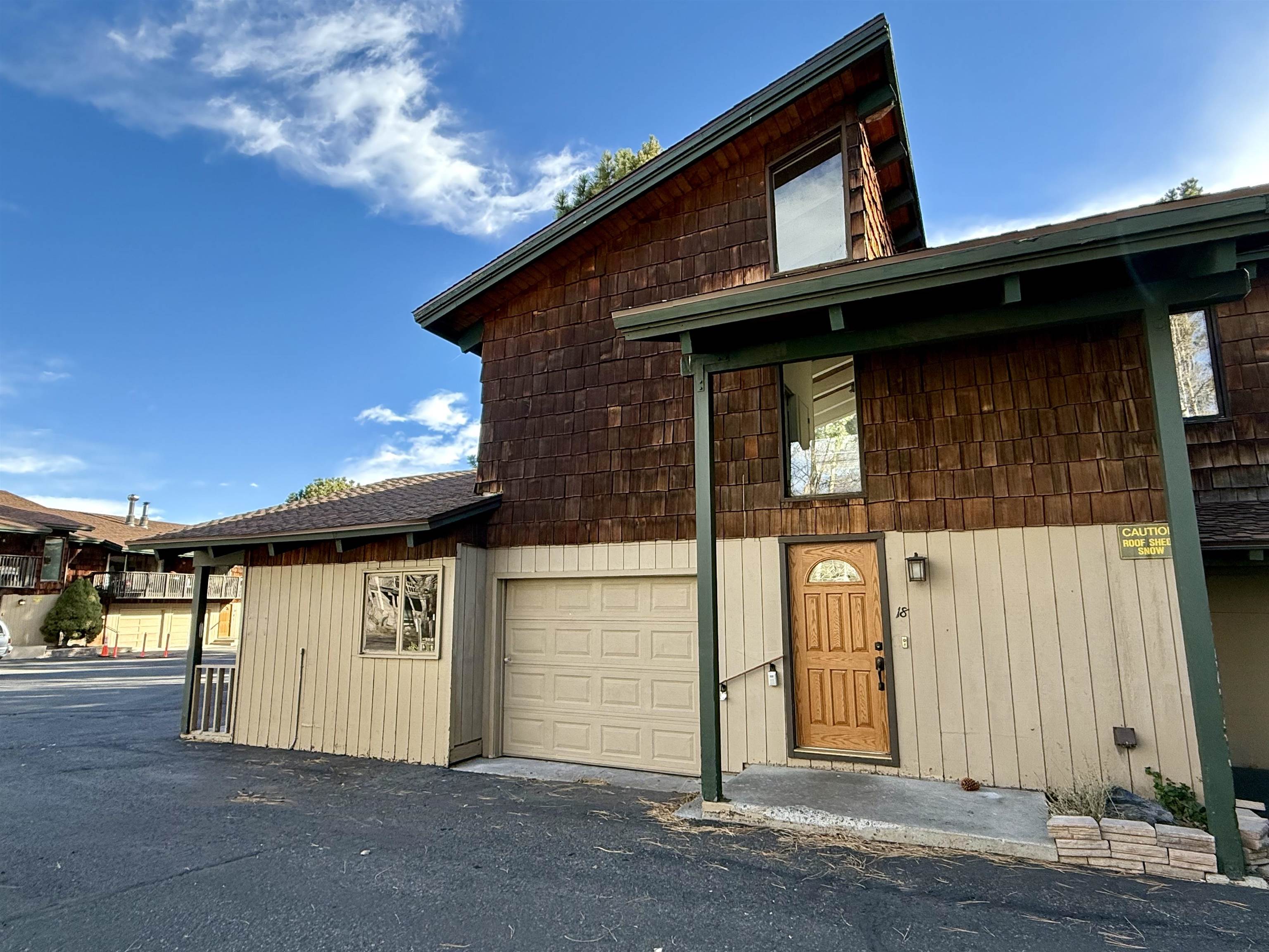 View of front facade featuring a garage
