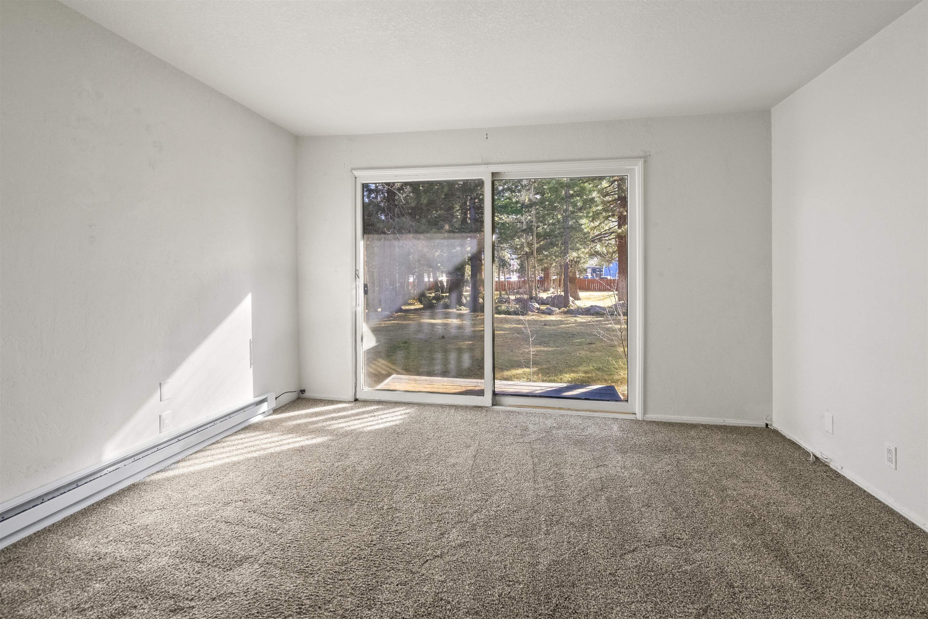 3199 Chateau Road, Unit 18 Mammoth Lakes, CA 93546 - Photo 12 of 19 Carpeted empty room featuring a baseboard radiator