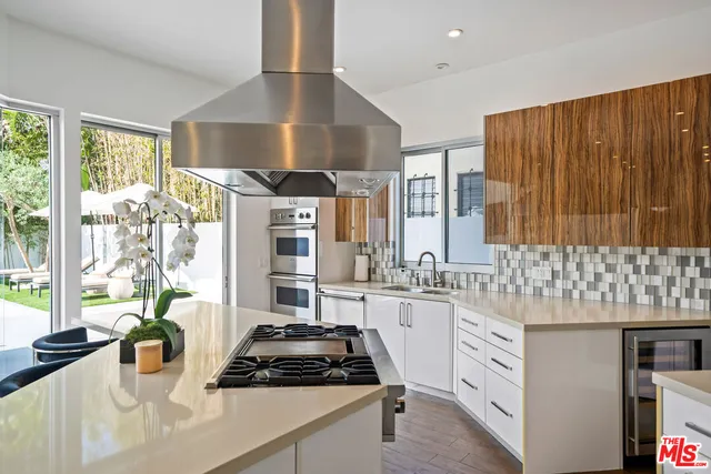 a kitchen with a table and chairs