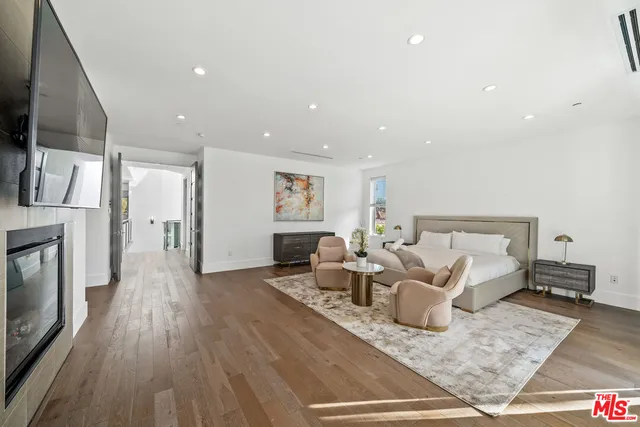 a large spacious bathroom with a granite countertop tub a double vanity sink a mirror and a shower