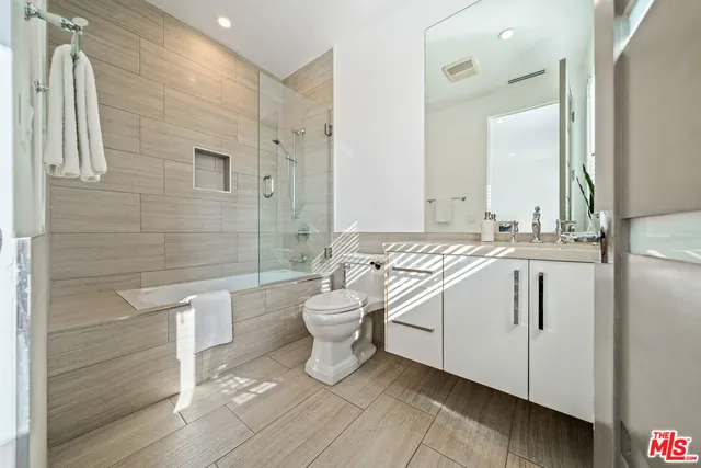 a swimming pool view with a seating space