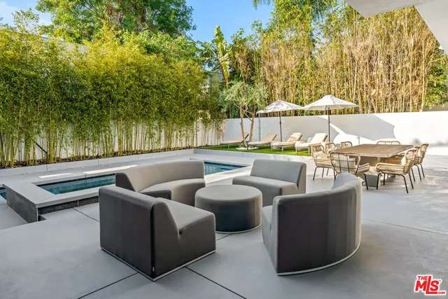 a view of a swimming pool with a patio