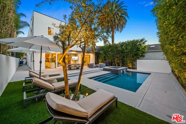 a view of a dining room with furniture and a potted plant