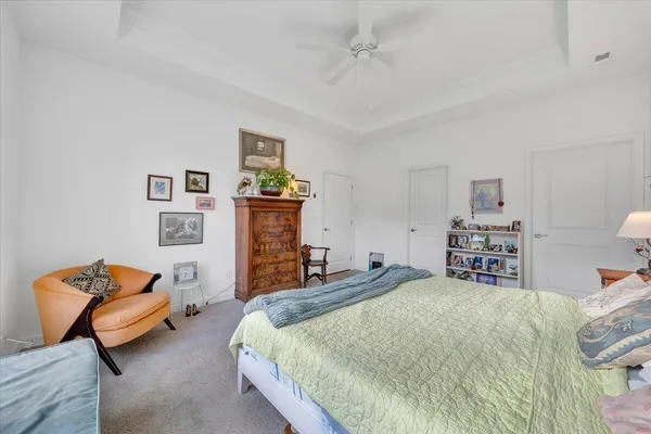 a bathroom with a shower sink vanity mirror and toilet