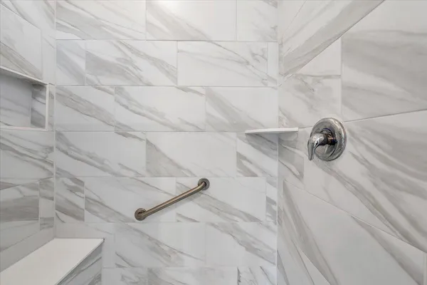 a bedroom with a bed and a chair