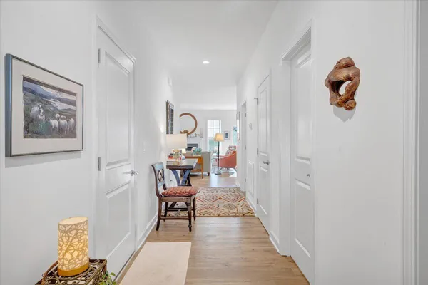 a view of a room with furniture and wooden floor