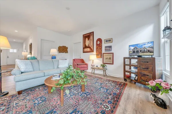 a living room with furniture a window and a fireplace