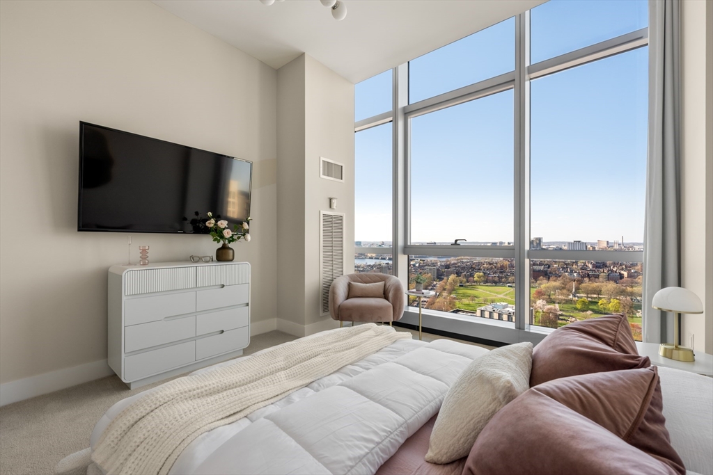 110 Stuart Street, Unit PH Boston, MA 02116 - Photo 21 of 37 a bedroom with a bed and large window