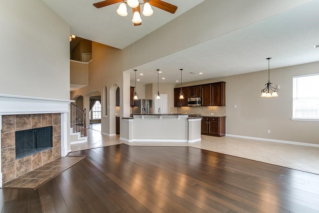 5803 Cedar Field Way Houston, TX 77084 - Photo 10 of 14 a view of kitchen with cabinets and wooden floor