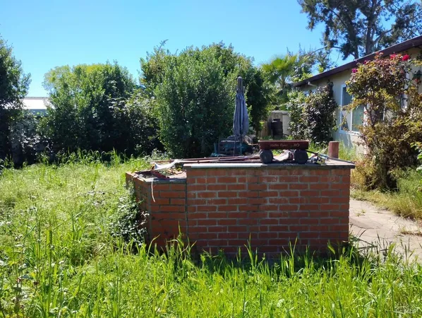 a view of outdoor sitting area with chairs