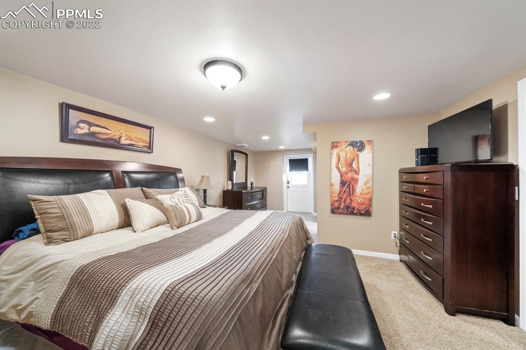 3645 Doolittle Road Monument, CO 80132 - Photo 20 of 39 a bedroom with a bed and dresser