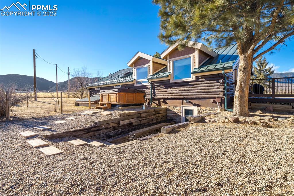 3645 Doolittle Road Monument, CO 80132 - Photo 22 of 39 a front view of a house with a yard