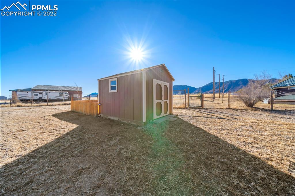 3645 Doolittle Road Monument, CO 80132 - Photo 25 of 39 a view of a backyard of a house