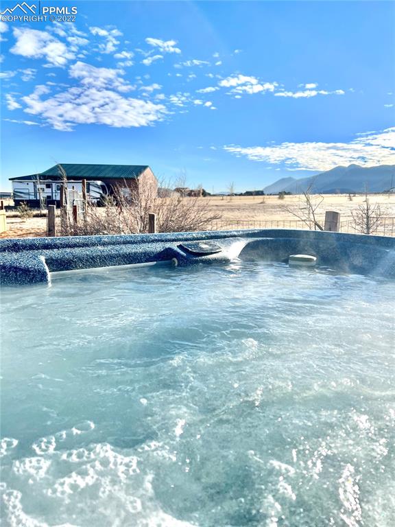 3645 Doolittle Road Monument, CO 80132 - Photo 30 of 39 a view of a swimming pool with an outdoor seating