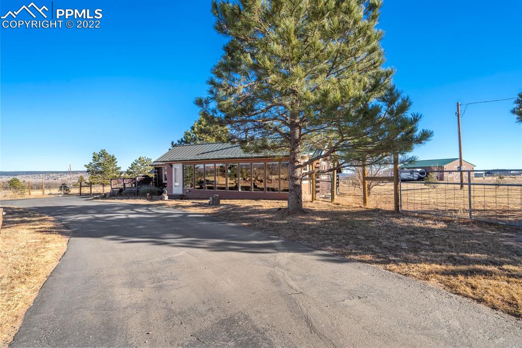 3645 Doolittle Road Monument, CO 80132 - Photo 31 of 39 a view of a house with street next to a road
