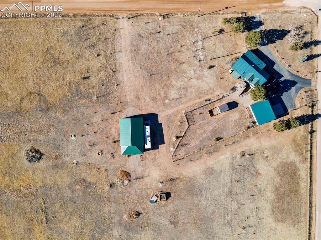3645 Doolittle Road Monument, CO 80132 - Photo 38 of 39 view of a dry yard with wooden wall