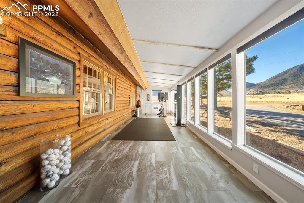 3645 Doolittle Road Monument, CO 80132 - Photo 5 of 39 a view of empty room with wooden floor and windows