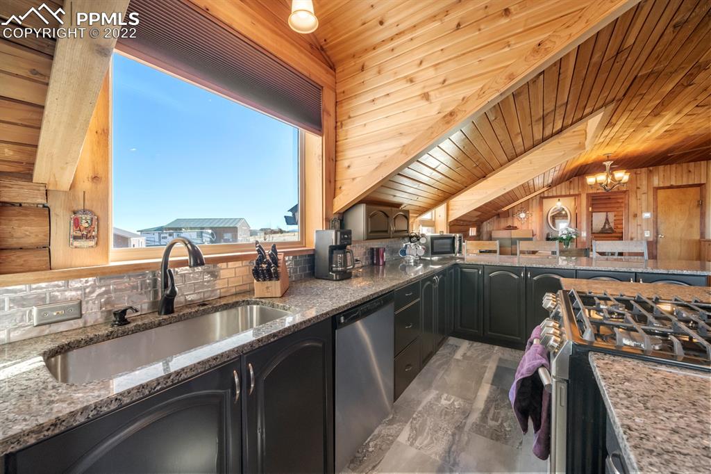 3645 Doolittle Road Monument, CO 80132 - Photo 6 of 39 a kitchen with a sink and a large window