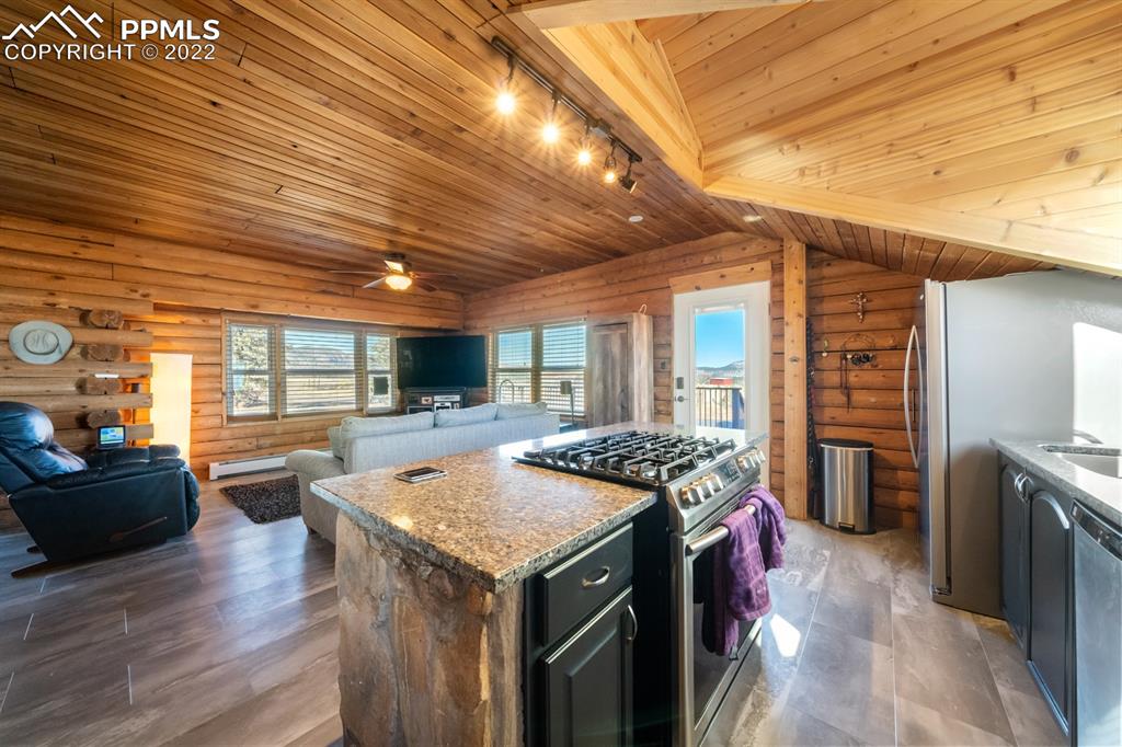 3645 Doolittle Road Monument, CO 80132 - Photo 7 of 39 a kitchen with a stove and refrigerator