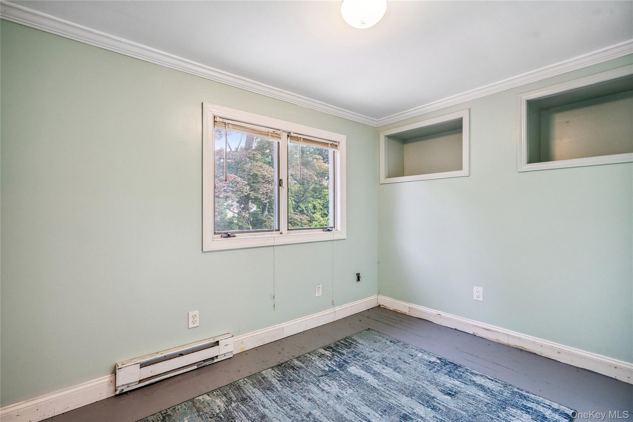 17 Tulip Road Rocky Point, NY 11778 - Photo 17 of 24 an empty room with a window