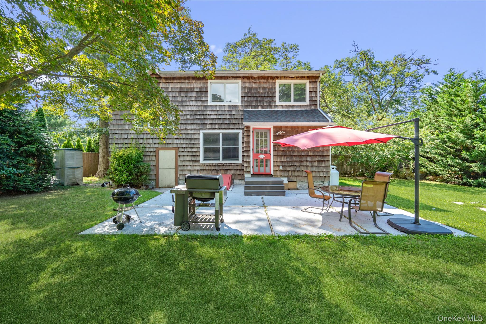 17 Tulip Road Rocky Point, NY 11778 - Photo 23 of 24 a view of a house with a backyard