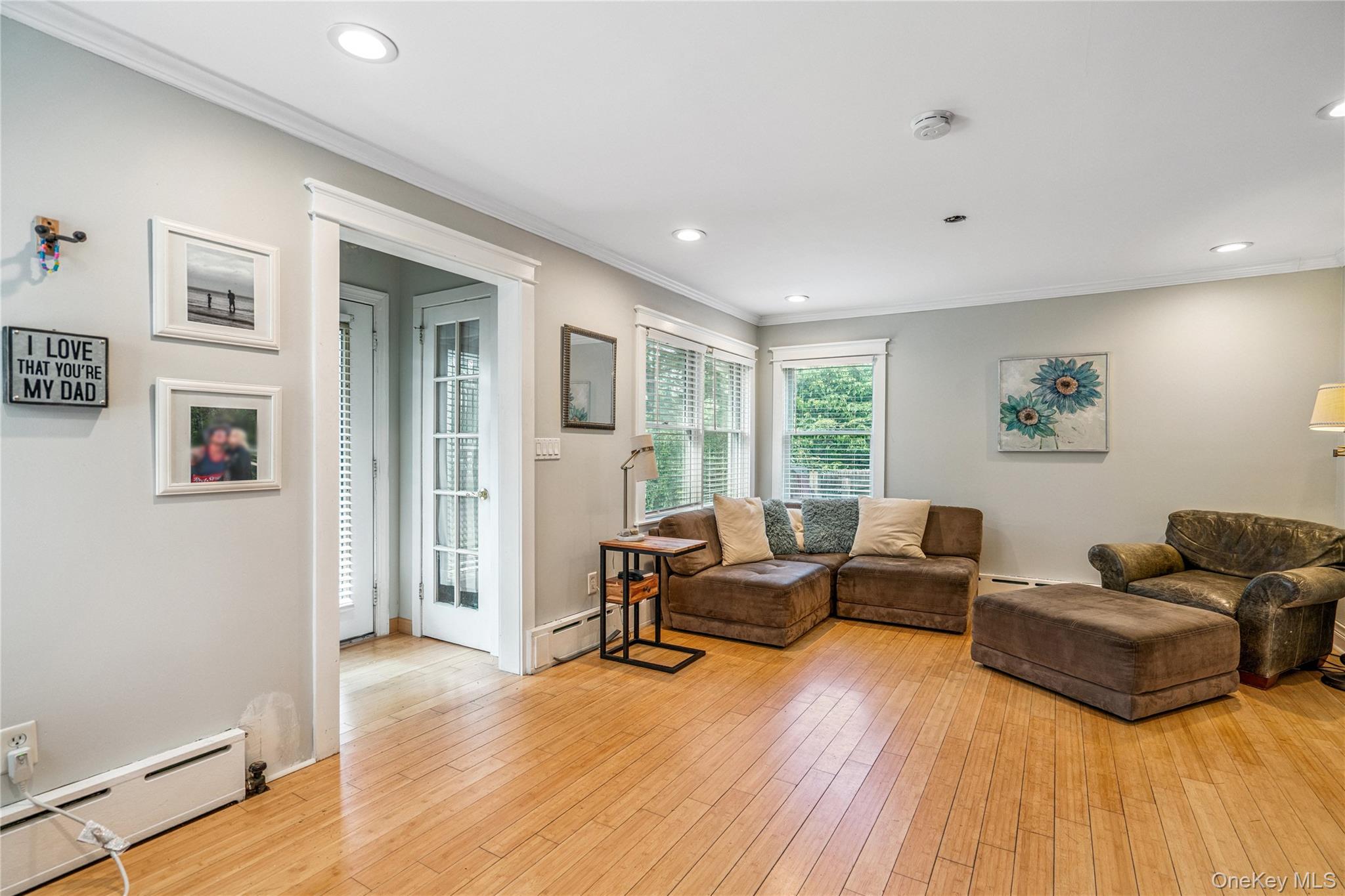 17 Tulip Road Rocky Point, NY 11778 - Photo 7 of 24 a living room with furniture and a wooden floor
