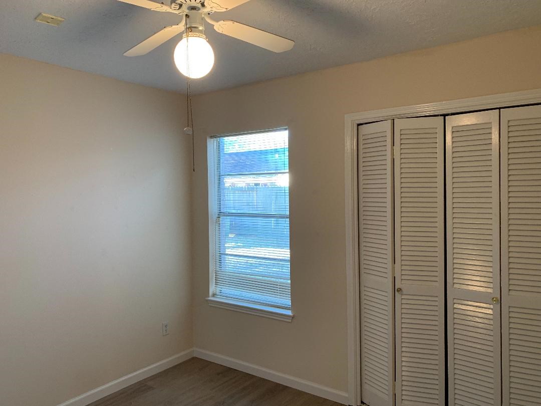 13819 Piping Rock Lane Houston, TX 77077 - Photo 12 of 16 a view of an empty room with a window