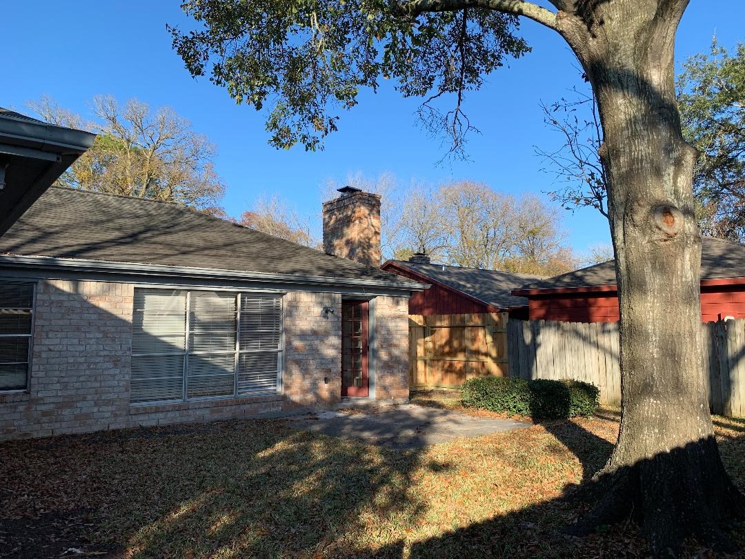 13819 Piping Rock Lane Houston, TX 77077 - Photo 16 of 16 a view of a house with a yard