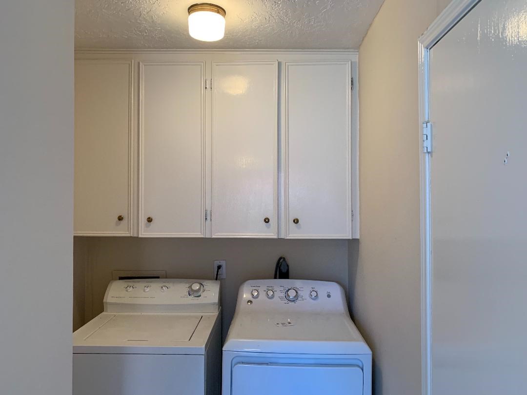 13819 Piping Rock Lane Houston, TX 77077 - Photo 7 of 16 a utility room with dryer and washer