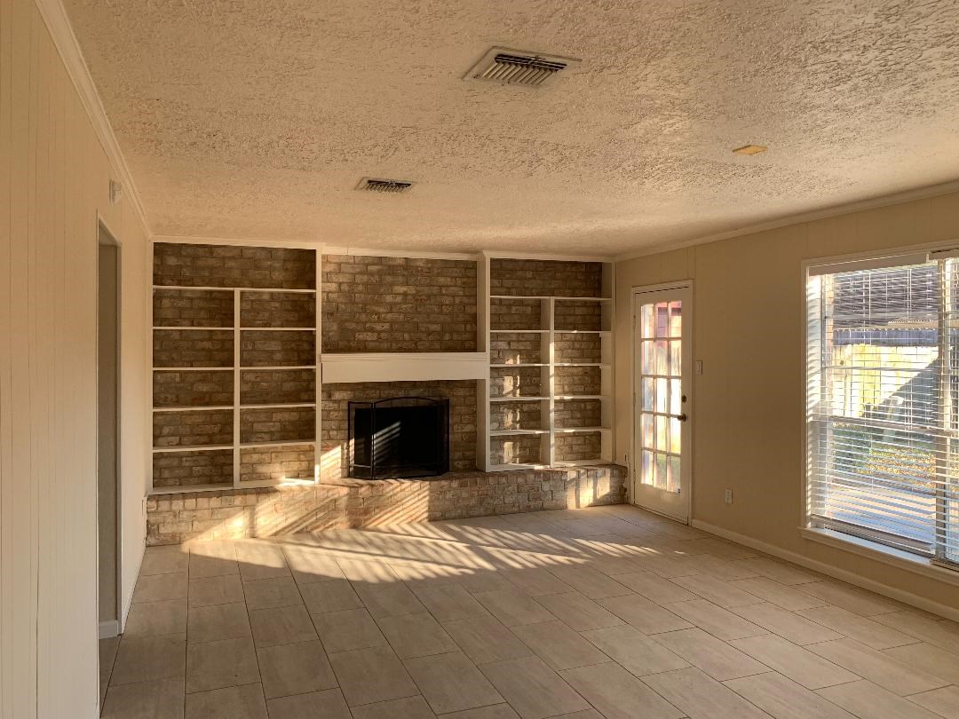 13819 Piping Rock Lane Houston, TX 77077 - Photo 8 of 16 a view of a livingroom with a fireplace