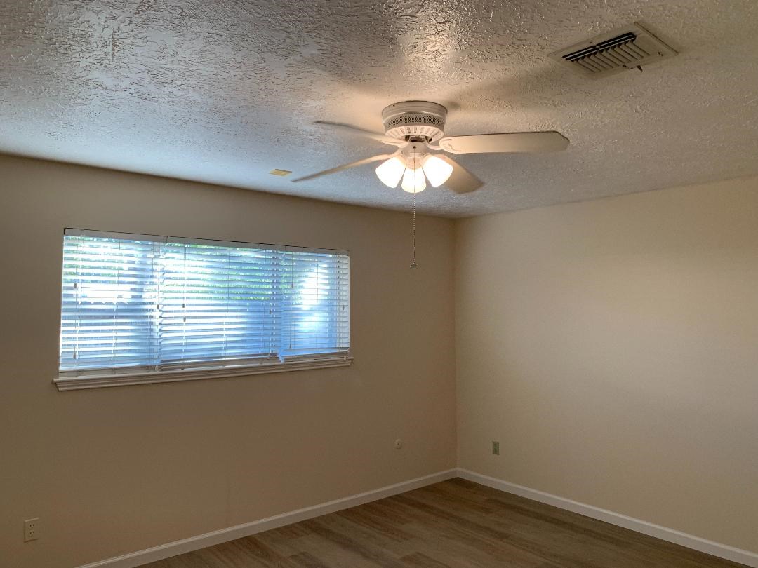 13819 Piping Rock Lane Houston, TX 77077 - Photo 10 of 16 an empty room with a window