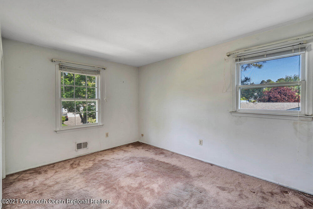 60 Charles Drive Tinton Falls, NJ 07753 - Photo 12 of 23 an empty room with a window