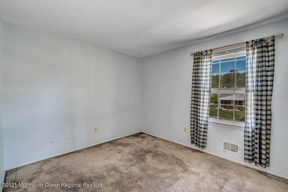 60 Charles Drive Tinton Falls, NJ 07753 - Photo 13 of 23 an empty room with windows