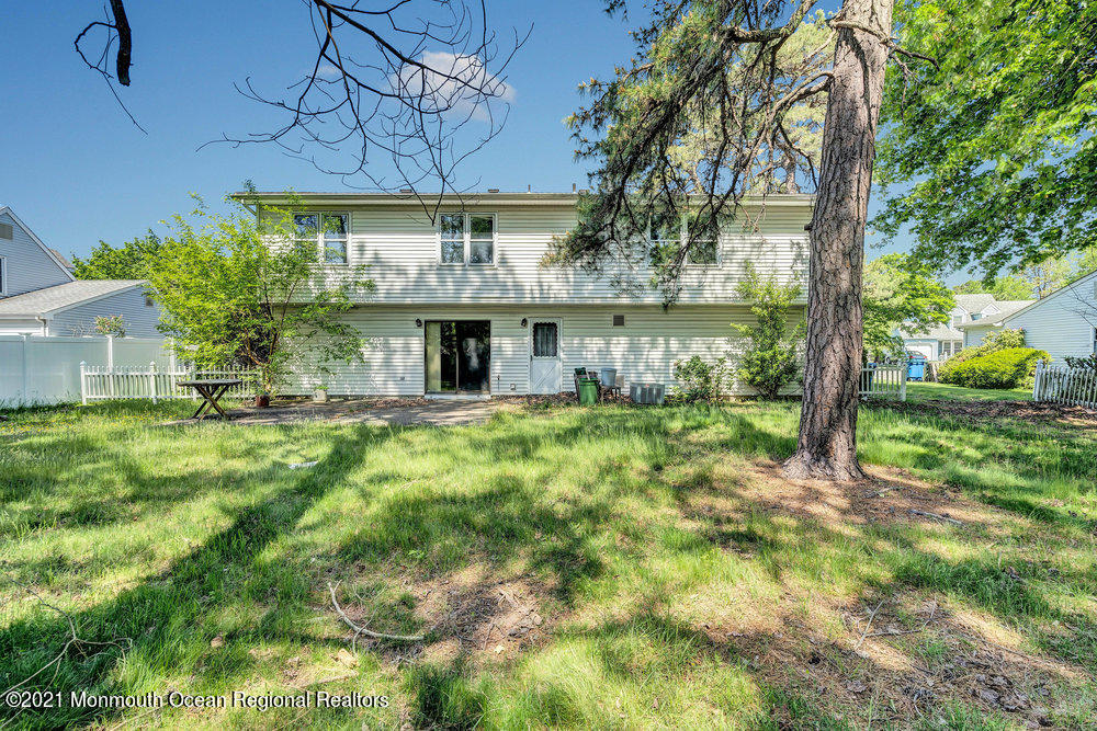 60 Charles Drive Tinton Falls, NJ 07753 - Photo 20 of 23 a front view of a house with garden