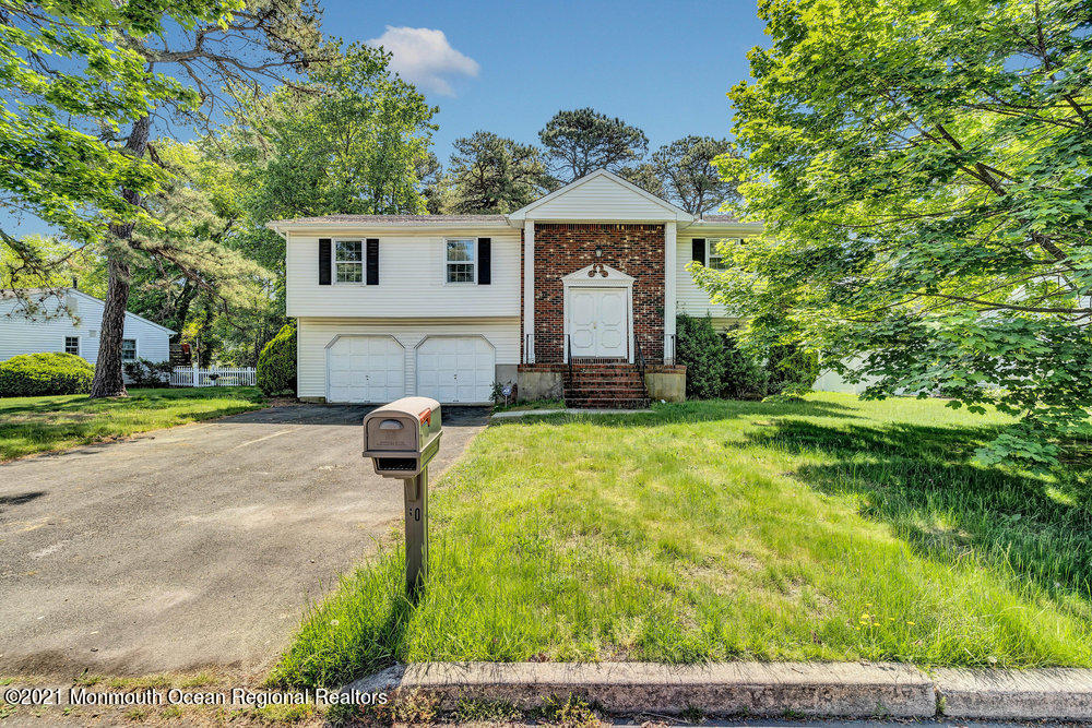 60 Charles Drive Tinton Falls, NJ 07753 - Photo 23 of 23 a front view of a house with garden