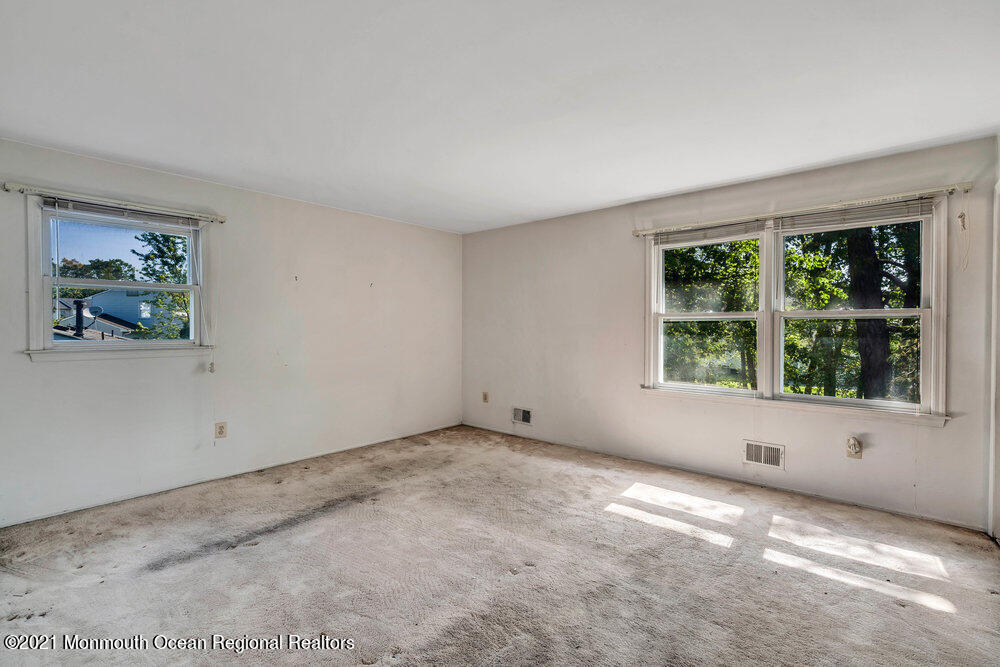 60 Charles Drive Tinton Falls, NJ 07753 - Photo 10 of 23 an empty room with a window
