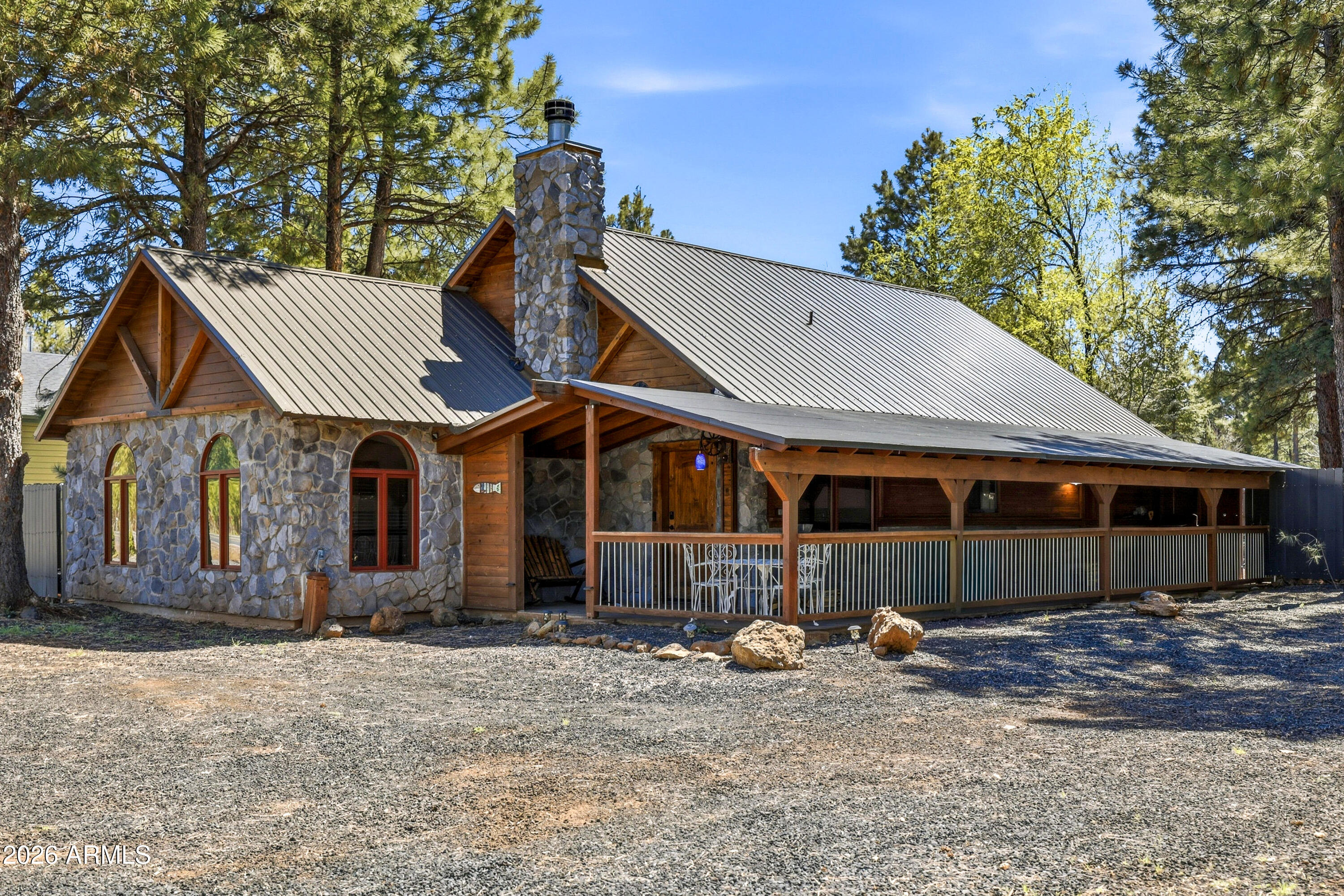 4971 Buck Springs Road Pinetop, AZ 85935 - Photo 1 of 32 a view of a house with a yard and large tree