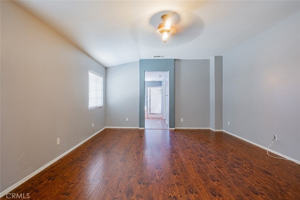 6349 Catania Court Palmdale, CA 93552 - Photo 20 of 36 an empty room with a window and wooden floor