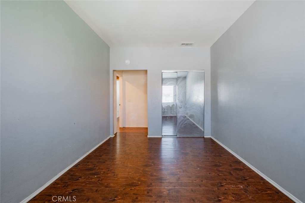 6349 Catania Court Palmdale, CA 93552 - Photo 26 of 36 a view of empty room with wooden floor