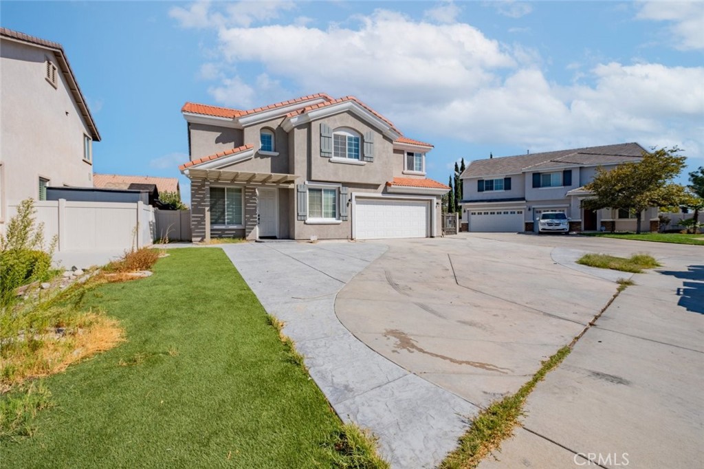 6349 Catania Court Palmdale, CA 93552 - Photo 3 of 36 a view of house with yard and car parked