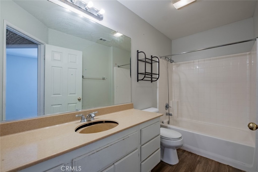 6349 Catania Court Palmdale, CA 93552 - Photo 31 of 36 a bathroom with a sink a toilet and shower