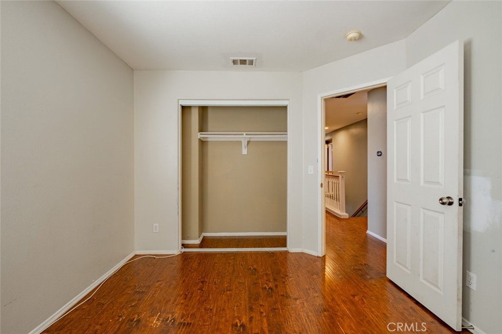 6349 Catania Court Palmdale, CA 93552 - Photo 33 of 36 wooden floor in an empty room